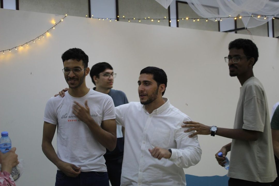 Members laughing together at the club's Ramadan 2025 event